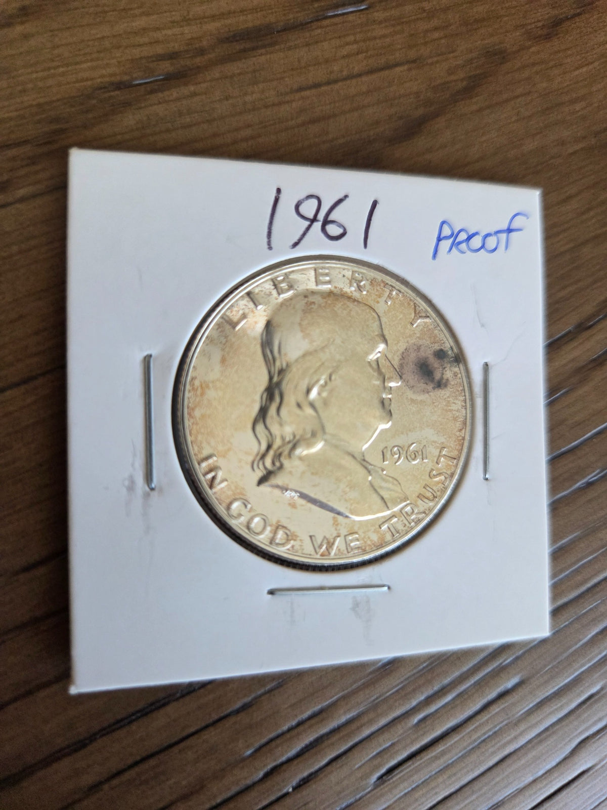 1961 Franklin Proof Half Dollar close-up showing dark spot near obverse rim, exact coin, SKU FH0017