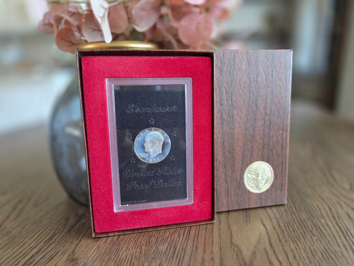 1971-S Eisenhower silver Proof dollar with light haze — obverse in original case and brown box