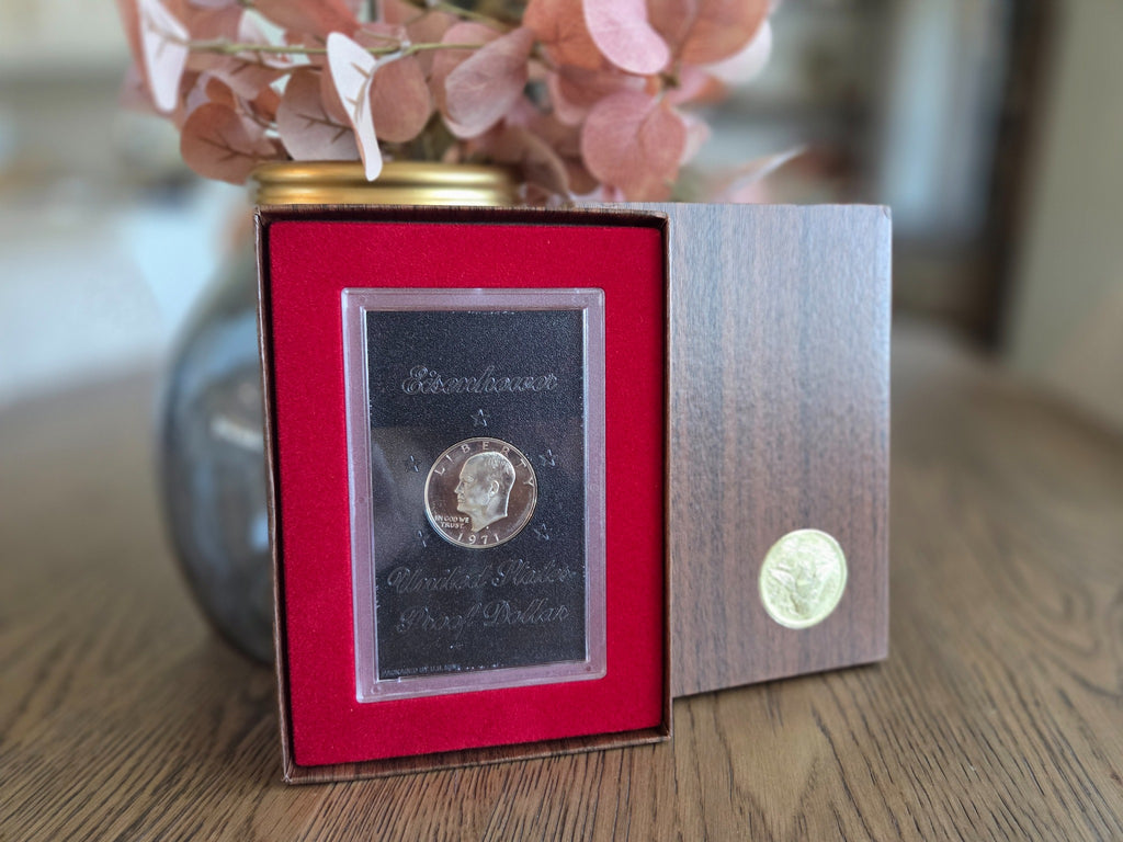1971-S Eisenhower silver Proof dollar with reflective fields — obverse in original case and brown box